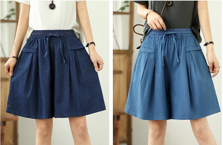 Two views of a person wearing a blue skirt with a neutral background
