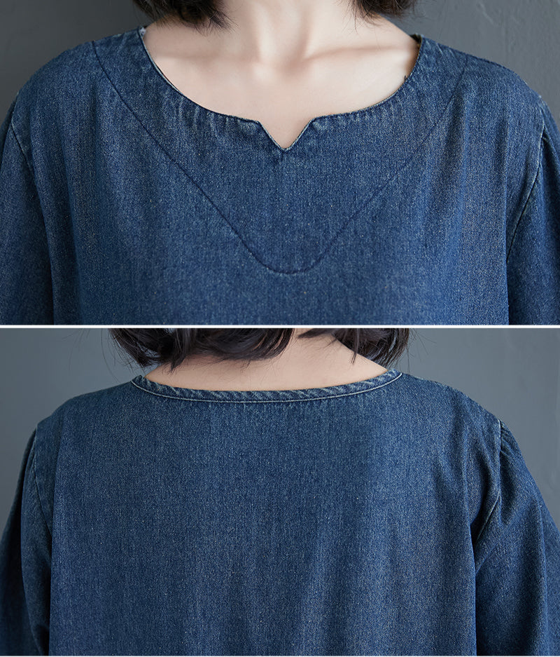 Close-up of a blue denim shirt with a collar on a gray background