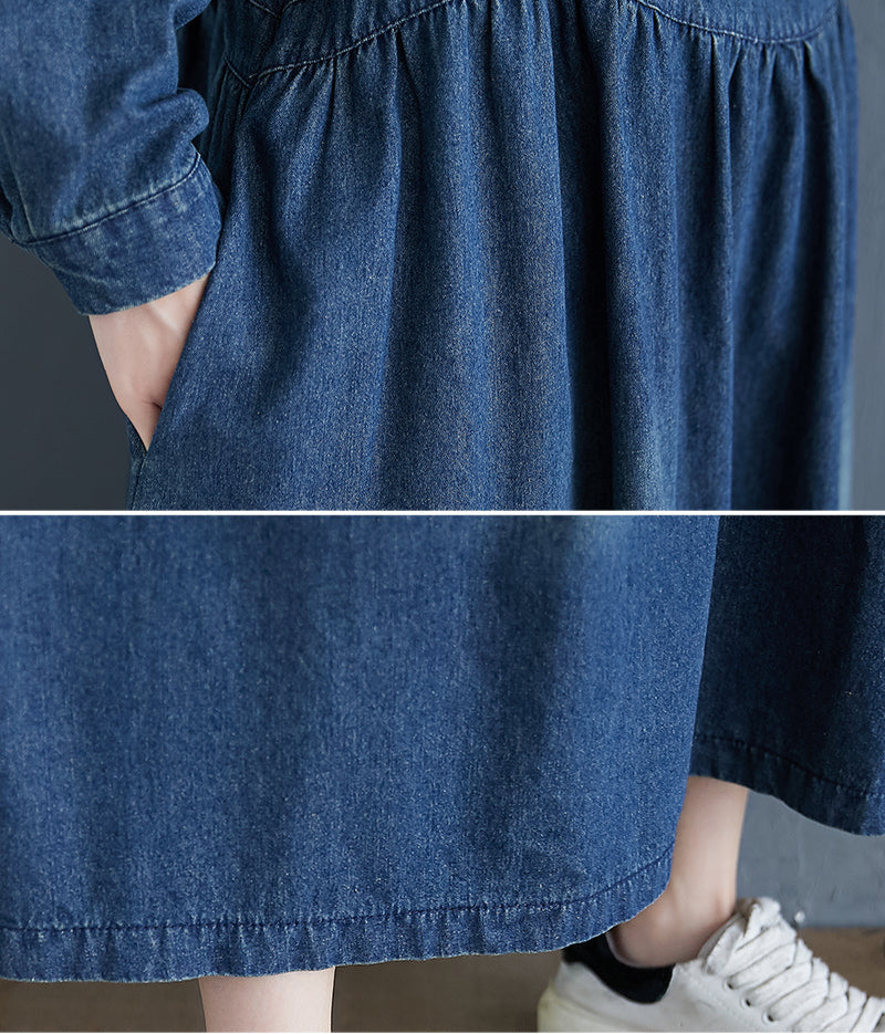 Close-up of a blue denim skirt worn by a person with white sneakers on a neutral background