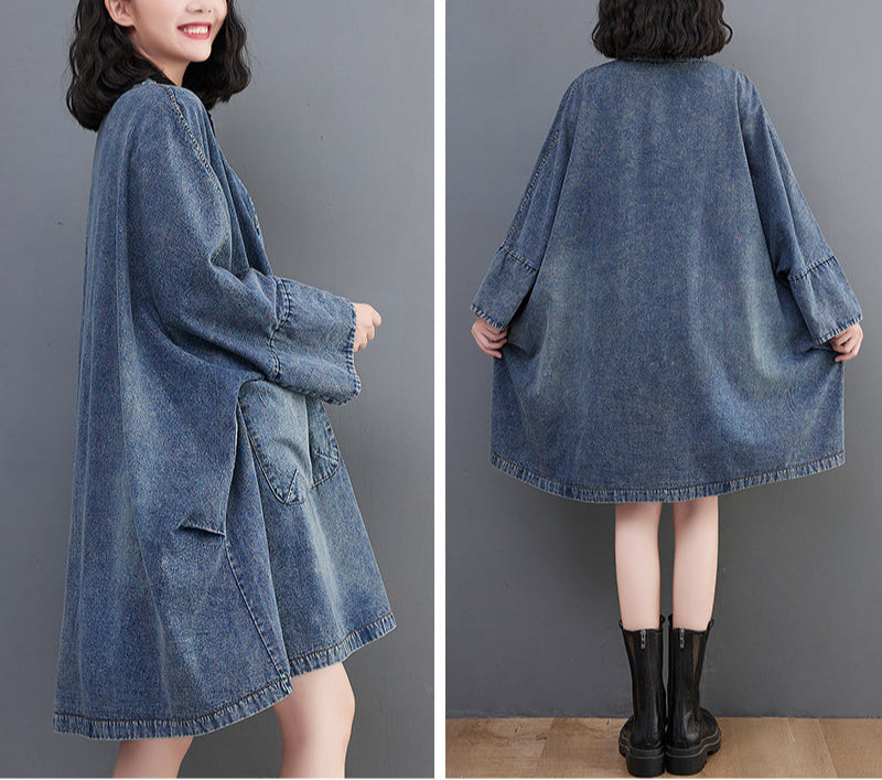 Blue denim dress worn by a person on a gray background