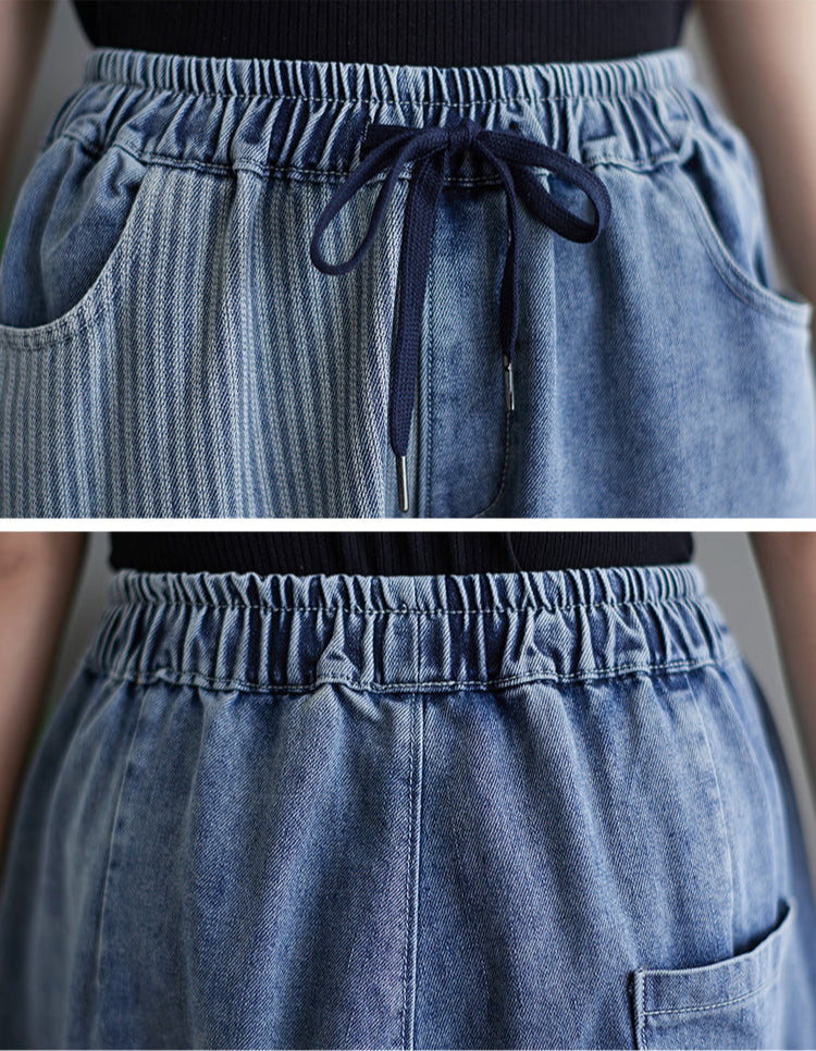 Close-up of a blue denim skirt with an elastic waistband and drawstring.