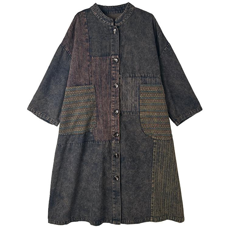 Long denim dress with patchwork design on a white background