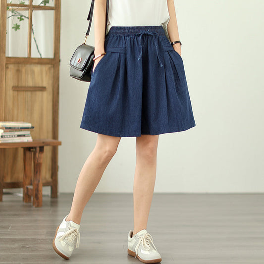 Person wearing a blue skirt in an indoor setting