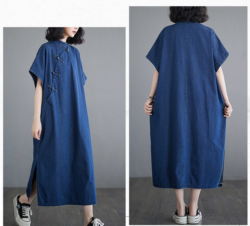 Blue denim dress worn by a person on a gray background