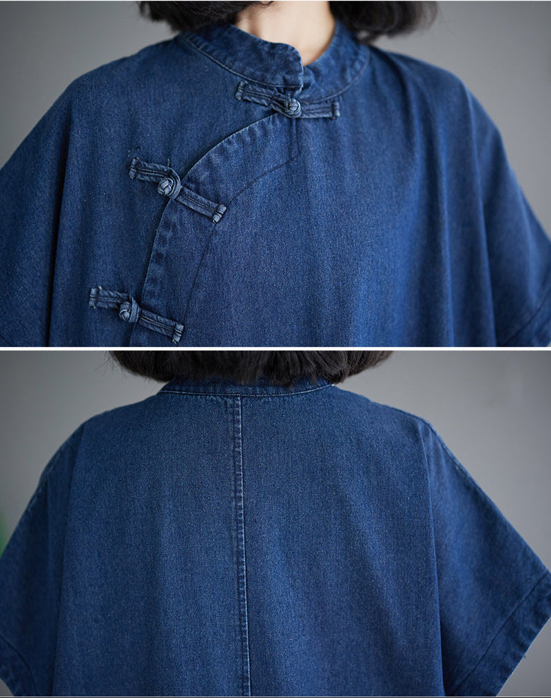 Blue denim shirt with button details on a gray background