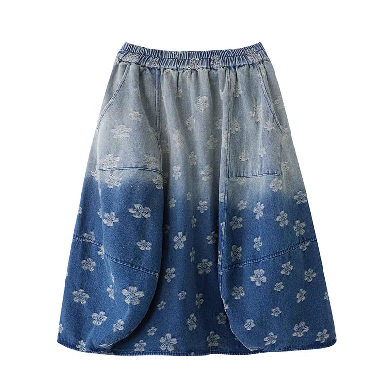 Blue denim skirt with floral pattern on a white background