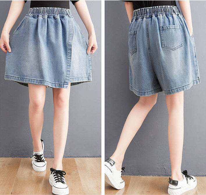 Denim skirt and shorts worn by a person on a plain background