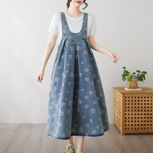 Woman wearing a blue floral dress with a white background