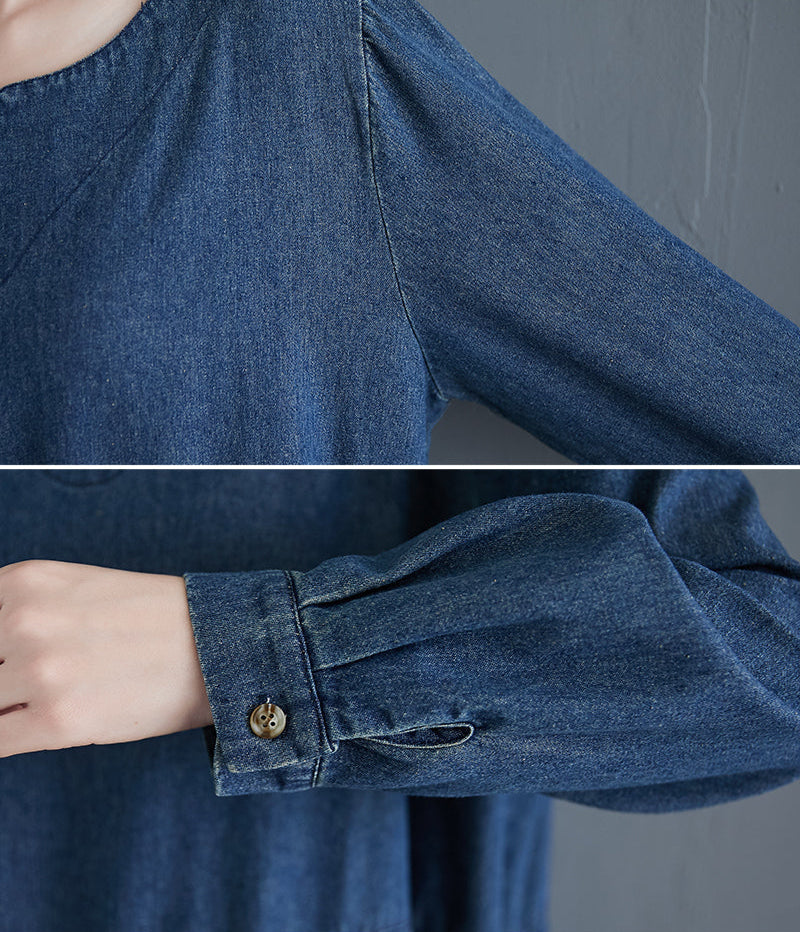Close-up of a blue denim shirt with a button on a gray background