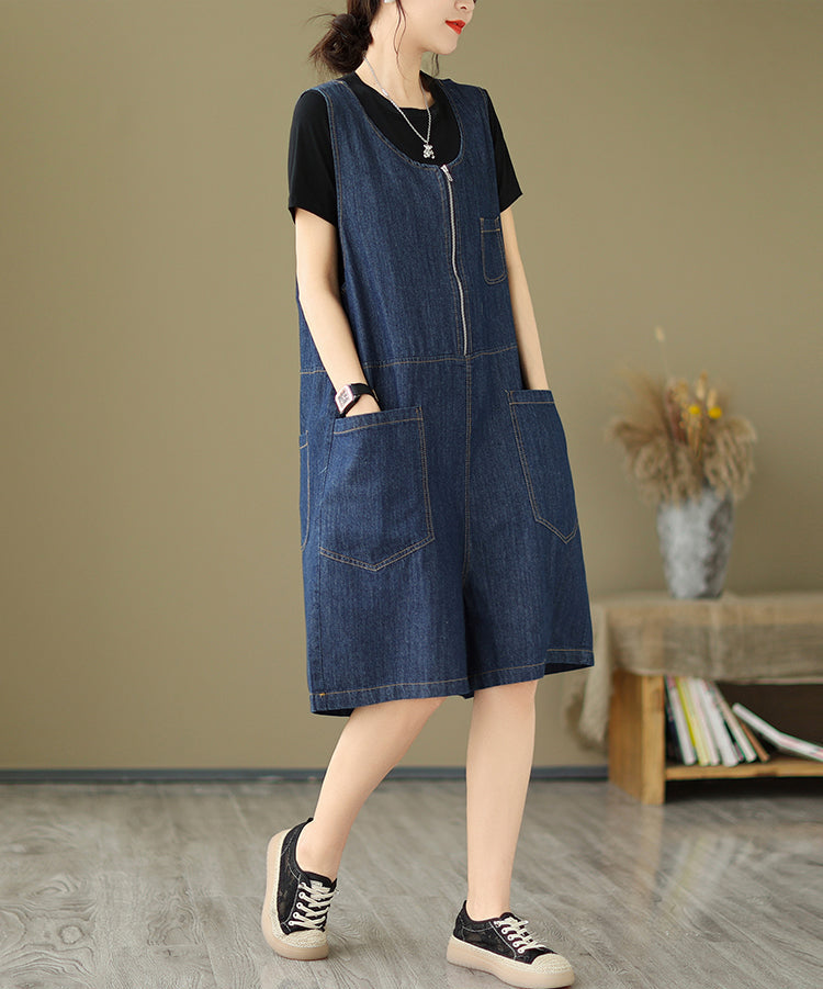 Woman wearing a denim shorts with a plain background