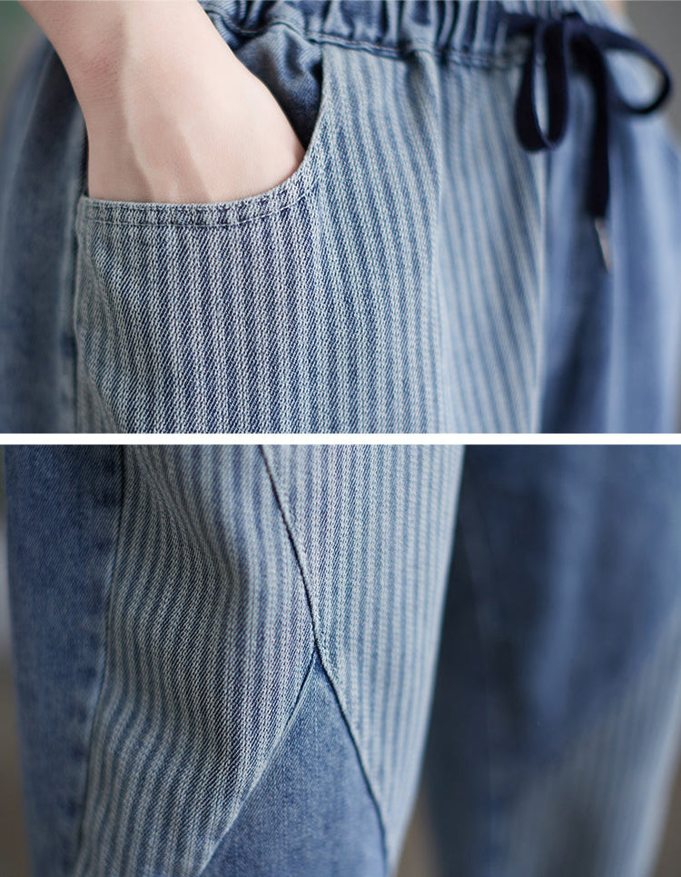 Close-up of blue denim pants with a focus on the fabric texture and stitching.